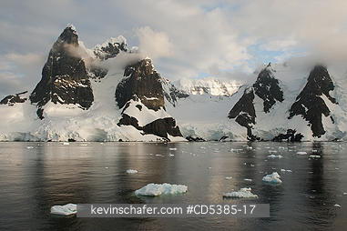 ANTARCTIC, SCENIC: Sunset on peaks of Lemaire Channel, Antarctic Peninsula, Antarctica