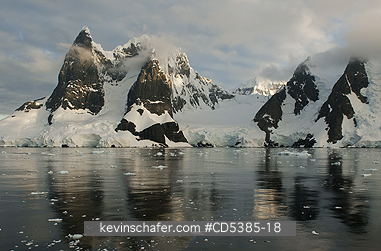 ANTARCTIC, SCENIC: Sunset on peaks of Lemaire Channel, Antarctic Peninsula, Antarctica