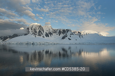 ANTARCTIC, SCENIC: Sunset on peaks, south of Lemaire Channel, Antarctic Peninsula, Antarctica