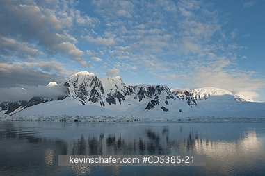 ANTARCTIC, SCENIC: Sunset on peaks, south of Lemaire Channel, Antarctic Peninsula, Antarctica