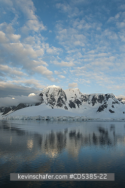 ANTARCTICA, SCENIC: Sunset on peaks, south of Lemaire Channel, Antarctic Peninsula, Antarctica