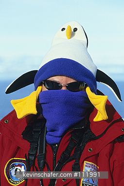 ANTARCTICA: Antarctica, Tourist in penguin hat.