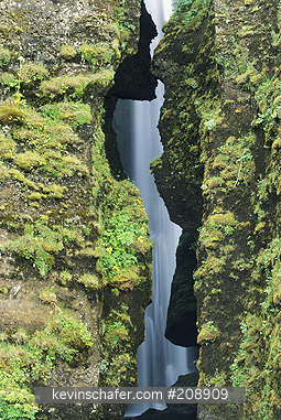 ICELAND: Iceland, Eyiafioll area below Myrdalsiokull Glacier, Waterfall in narrow gorge.