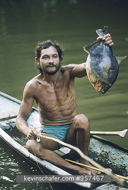 BRAZIL: Brazil, Amazon River, Cabocolo fisherman with catch.